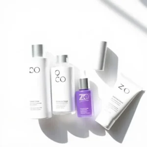 Flat lay of ZO Skin Care products including cleanser, toner, serum, and sunscreen for healthy skin