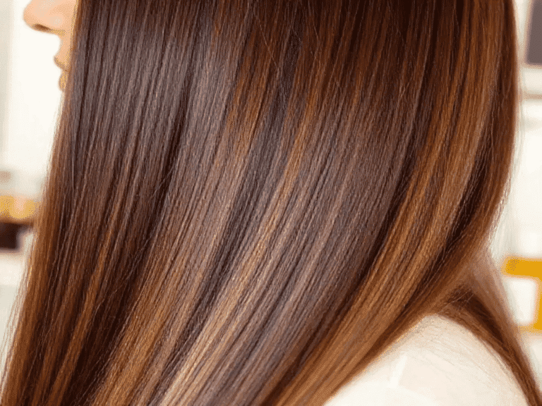 Top Layer Hair Repair – Close-up of a woman with long, smooth, shiny brown hair, healthy, frizz-free, and well-nourished